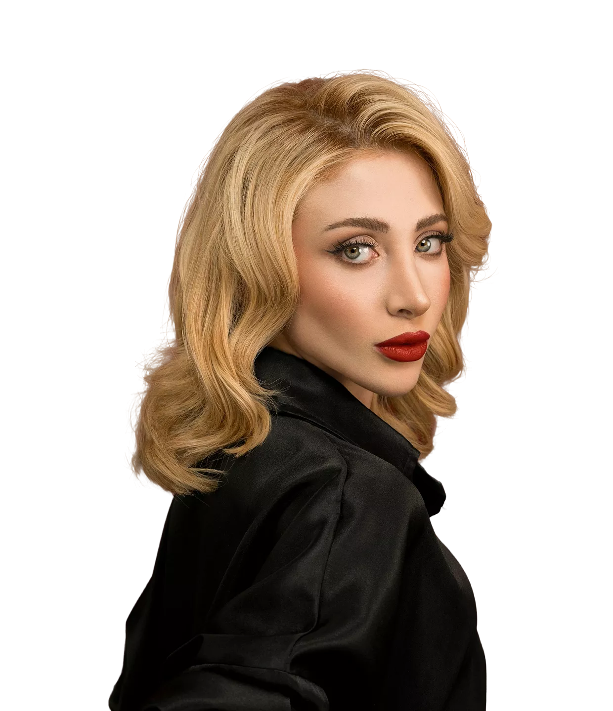 Woman with shoulder-length blonde wavy hair wearing black button-up shirt against black background