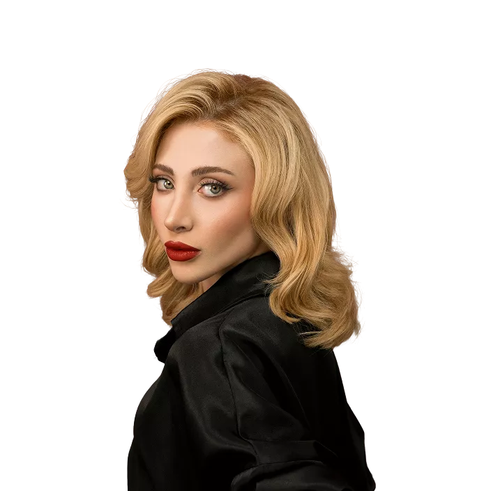 Woman with shoulder-length blonde wavy hair wearing black button-up shirt against black background